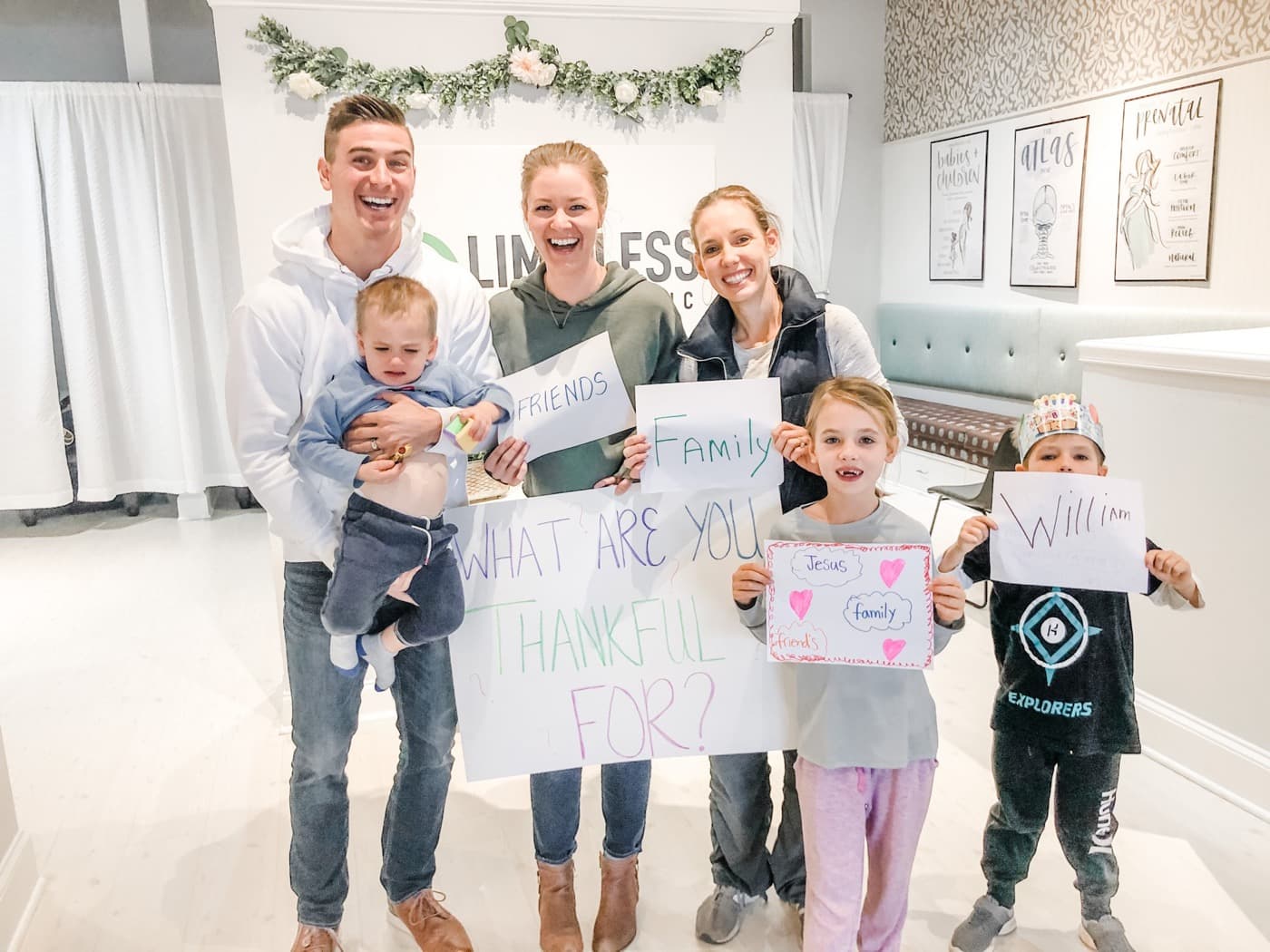 Dr. Tim and Dr. Amanda with a family and their kids in the Limitless Chiropractic clinic in Ballantyne
