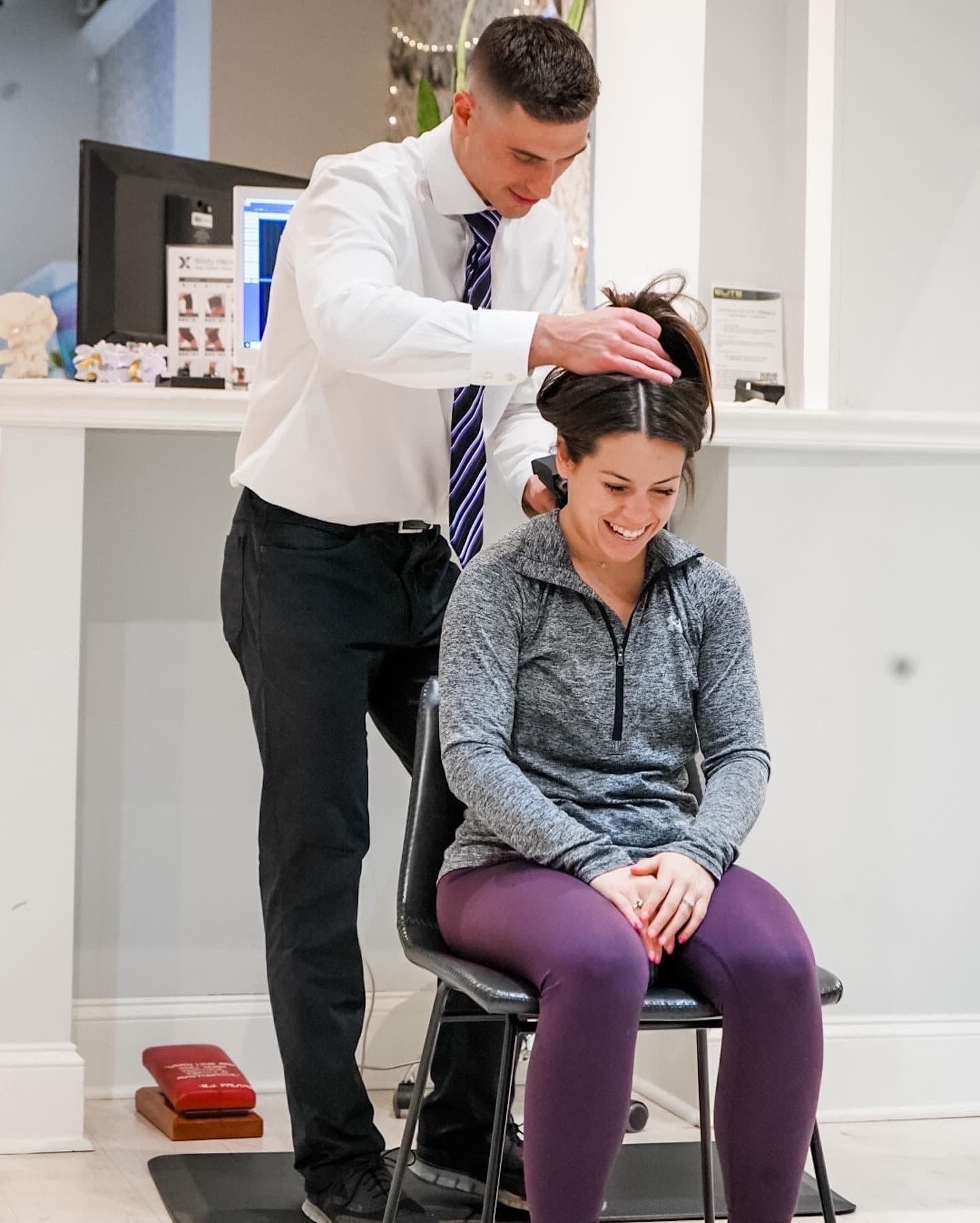 A Limitless Chiropractic doctor caring for a patient in the Ballantyne, Charlotte NC office